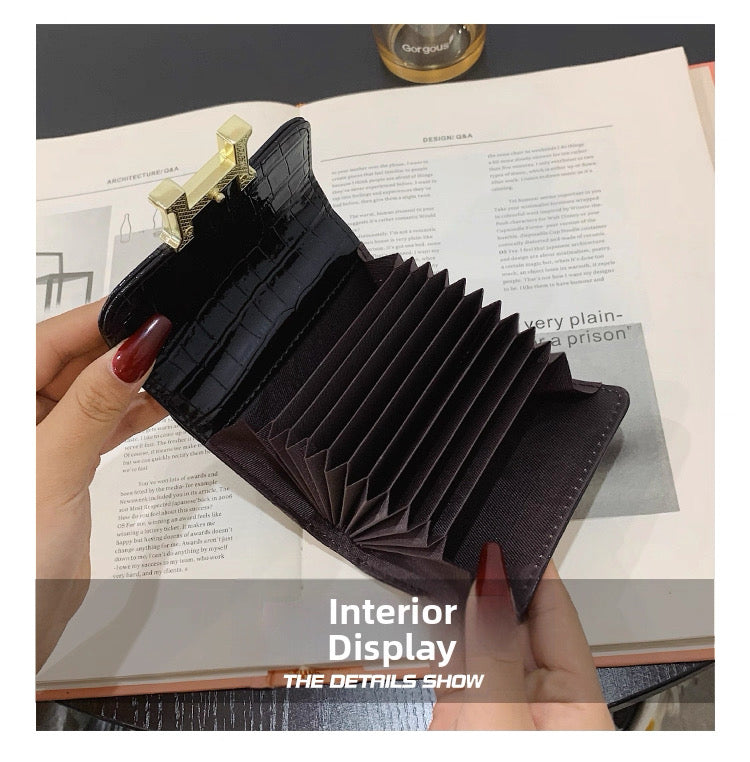 Hermès Constance Compact Wallet In rose gold hardware.