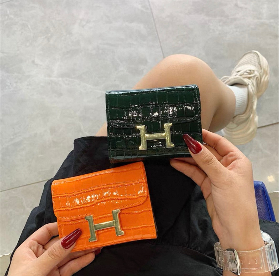 Hermès Constance Compact Wallet In rose gold hardware.