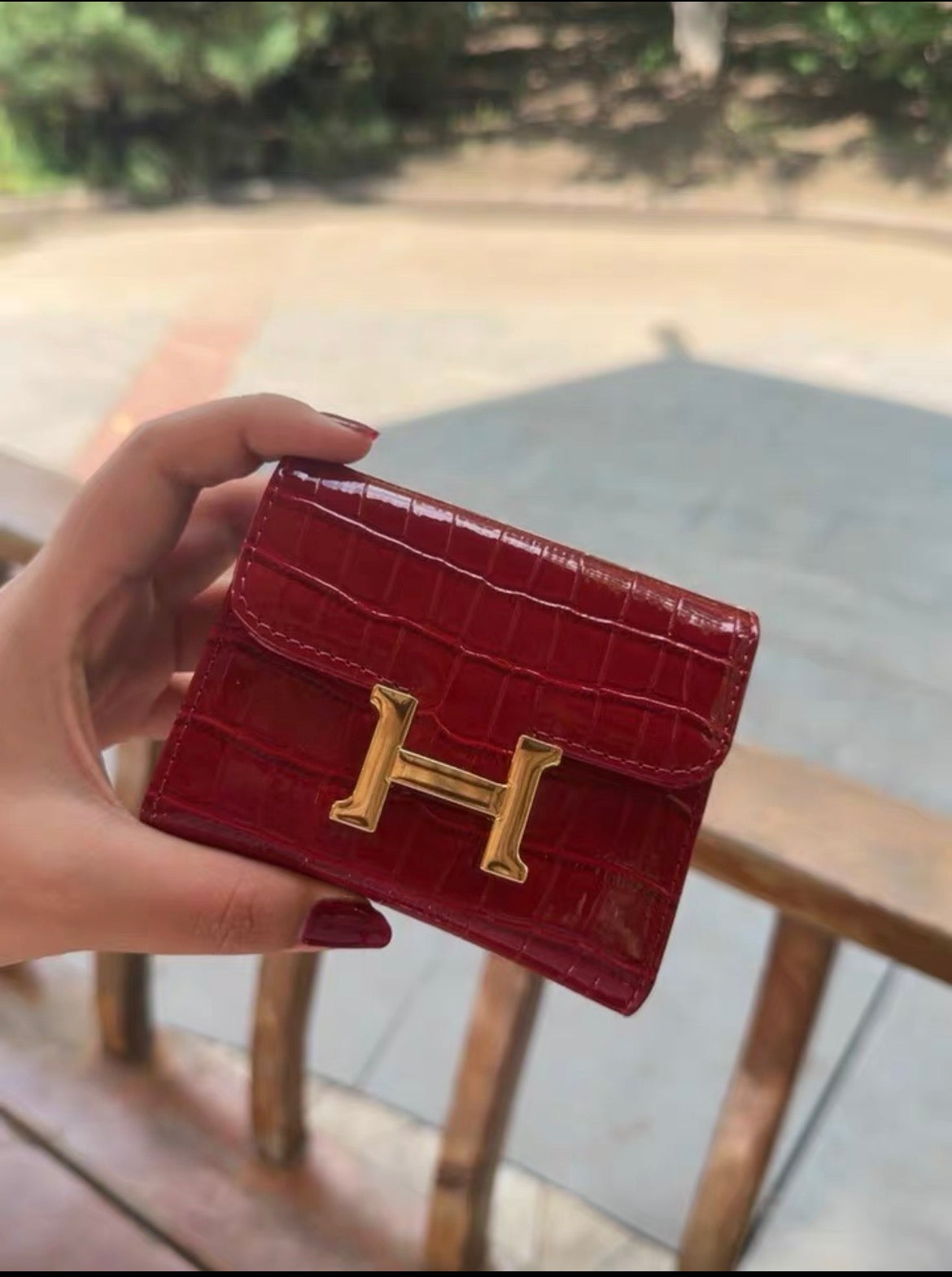 Hermès Constance Compact Wallet In rose gold hardware.