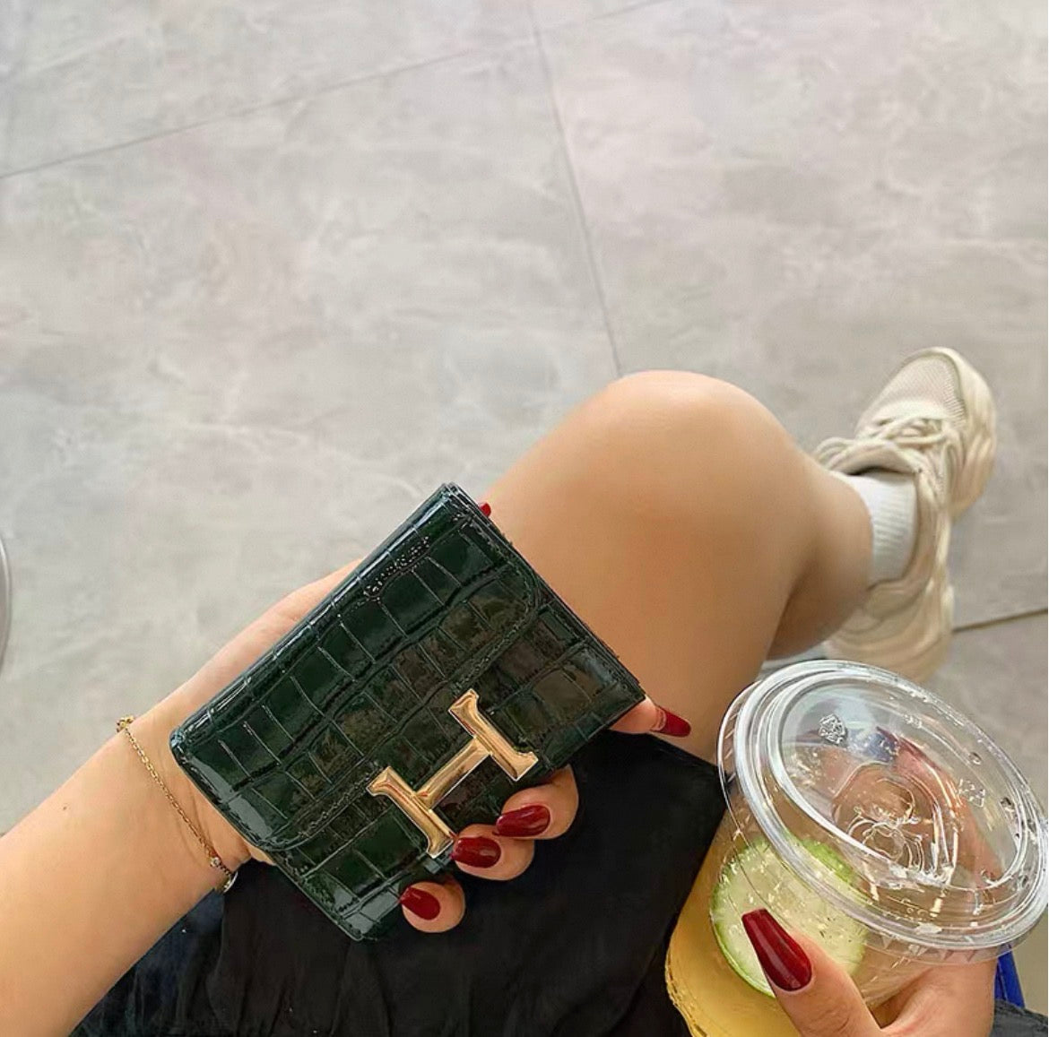 Hermès Constance Compact Wallet In rose gold hardware.